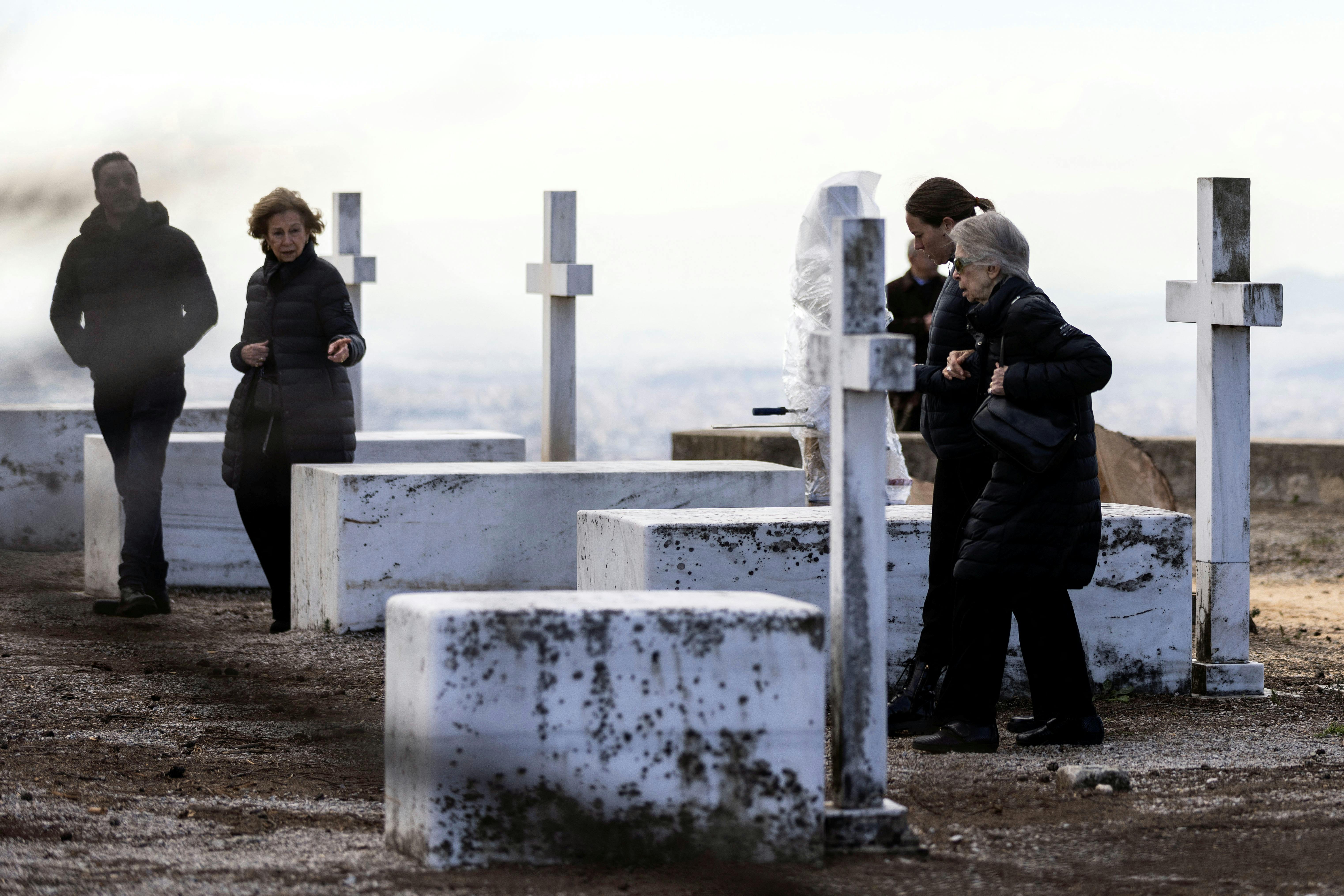 Spain's former queen Sofia and Greece's former princess Irene, sisters of Greece's late former King Constantine II, walk among tombs of members of the former Greek royal family, on the estate of the summer palace where Constantine II will be buried in Athens, Greece, January 12, 2023. REUTERS/Stelios Misinas