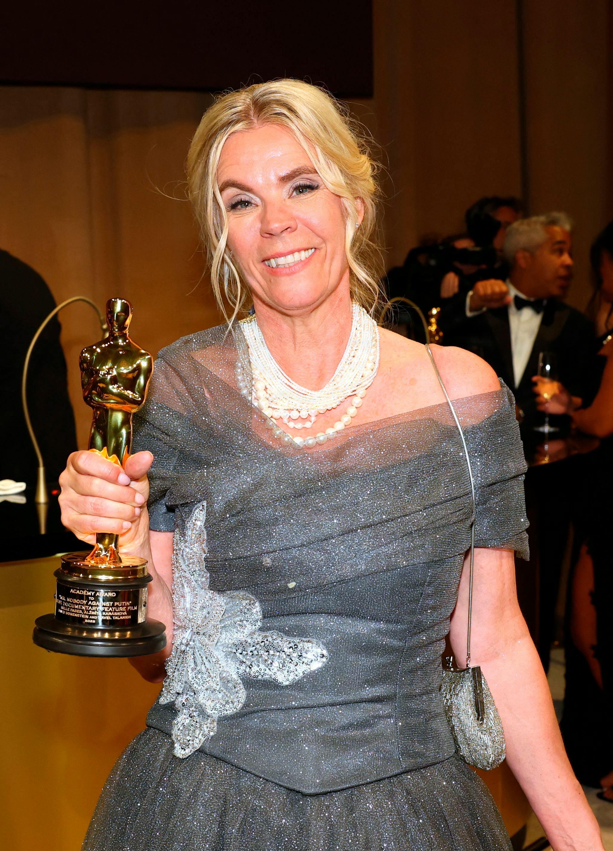 Danish producer Helle Faber holds her award for Best Documentary Feature Film for "Mr. Nobody Against Putin" at the 98th Annual Academy Awards Governors Ball at the Dolby Theatre in Hollywood, California on March 15, 2026. (Photo by ANGELA WEISS / AFP)