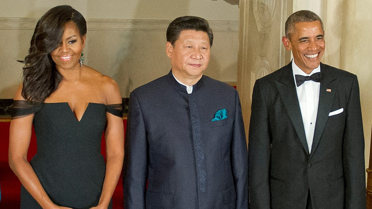 Michelle Obama flankeret af sin mand og den kinesiske præsident
