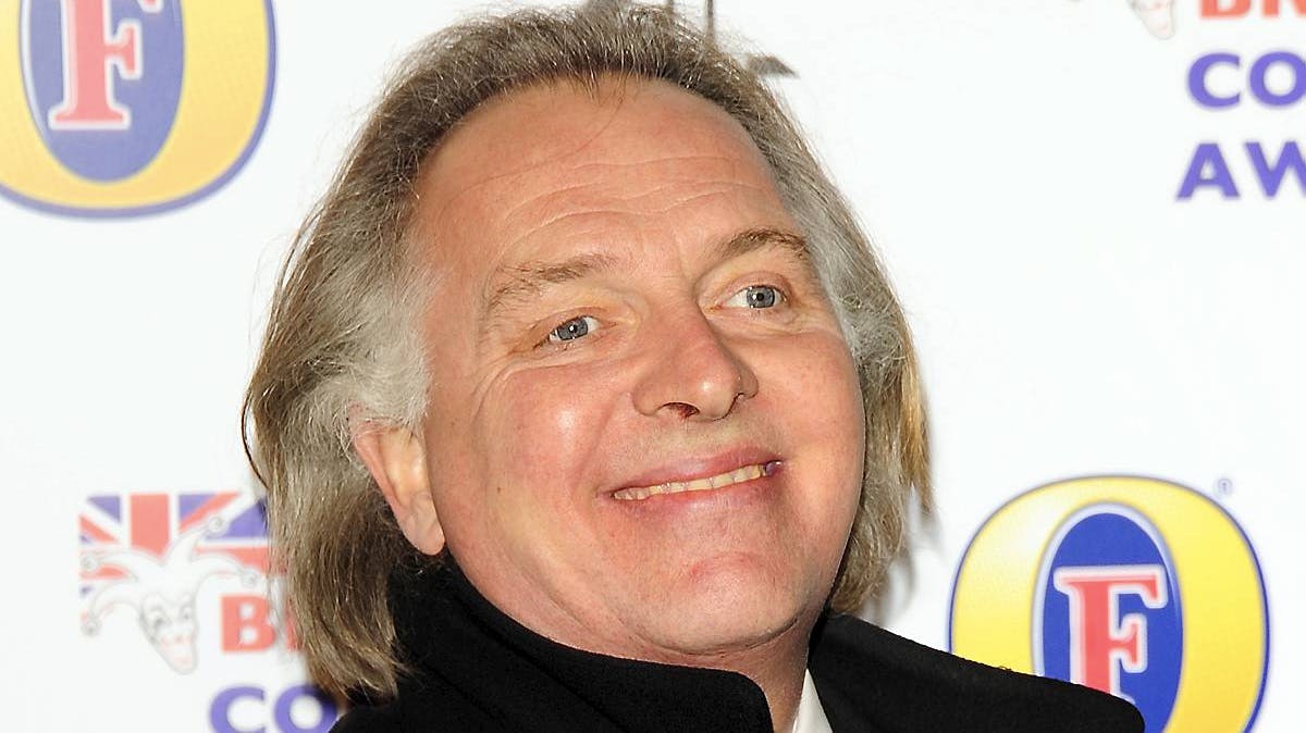 Rik Mayall.