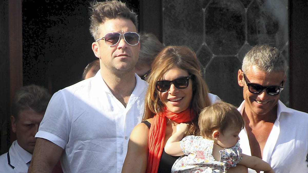 Robbie Williams, hustruen Ayda Field og datteren Theodora Rose i 2013.
